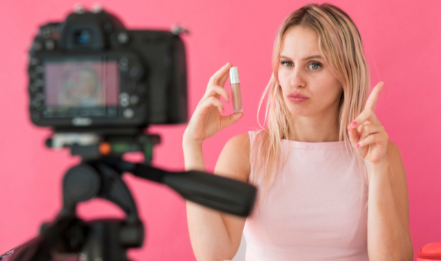 blonde influencer recording makeup video