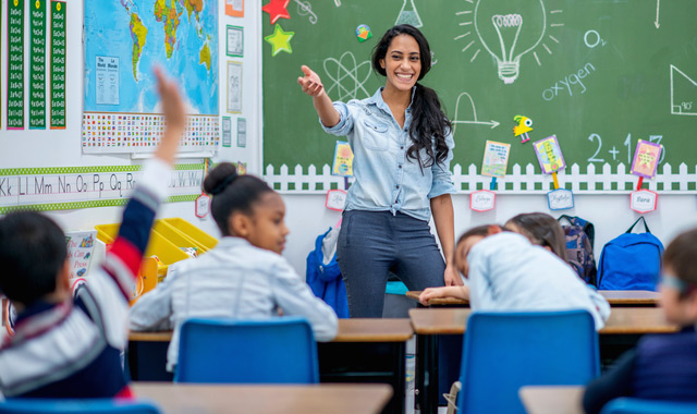 cheerful teacher in a classroom