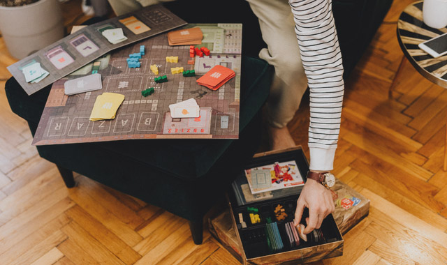 man holding playing board games