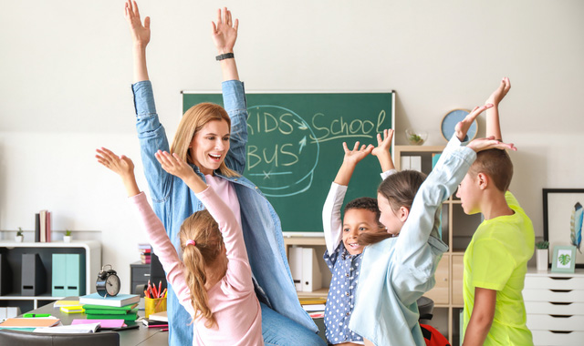 cheerful teacher with her pupils