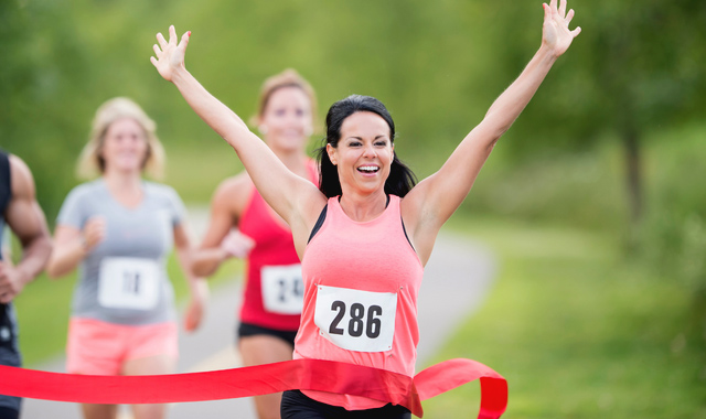 female marathon runner winning race