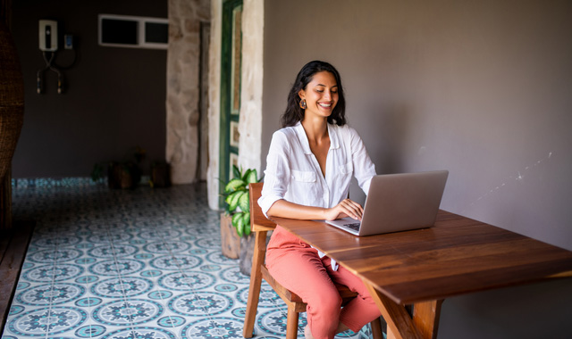 cheerful woman working from home
