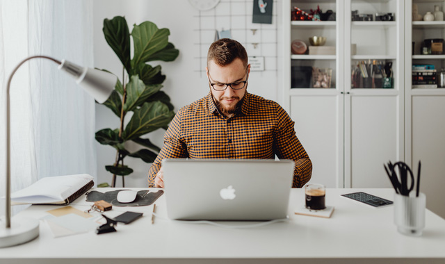 man working from home on laptop