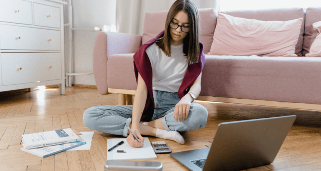 teen doing research on a computer