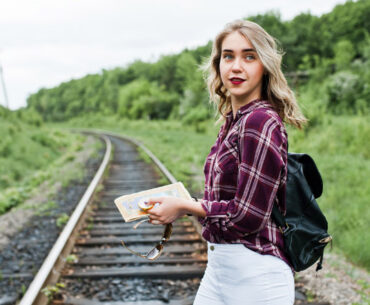 woman standing on train tracks