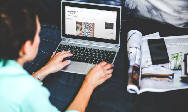 woman viewing a webpage on a laptop