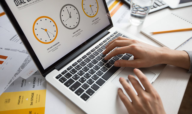 hands of businesswoman using laptop in office