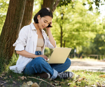 Remote work smiling asian girl student doing homework