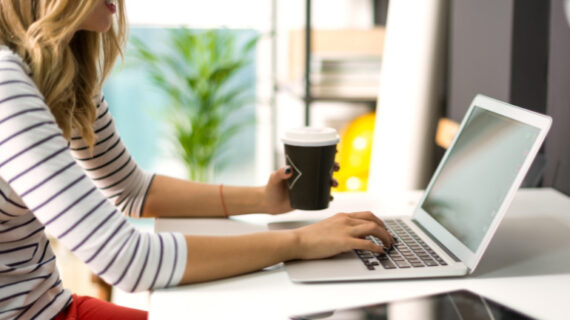 woman working using her laptop