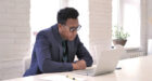 man wearing suit busy working