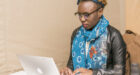 African woman working using with her laptop